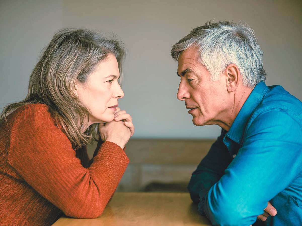 AI-generated image of a woman and a man facing one another. Both look serious.